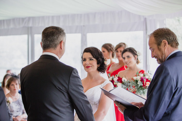 A wedding photo taken during a wedding ceremony at the Bracu Pavilion at the Simunovich Olive Estate in Rama Rama, near Auckland. This wedding photo was taken mb a wedding photographer in Auckland, named Mala Photography.