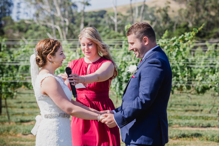 A photo taken during a wedding ceremony at the Hunting Lodge in Waimauku, near Auckland. Photo taken by Mala Photography, an Auckland based wedding photographer that shoots New Zealand wide.