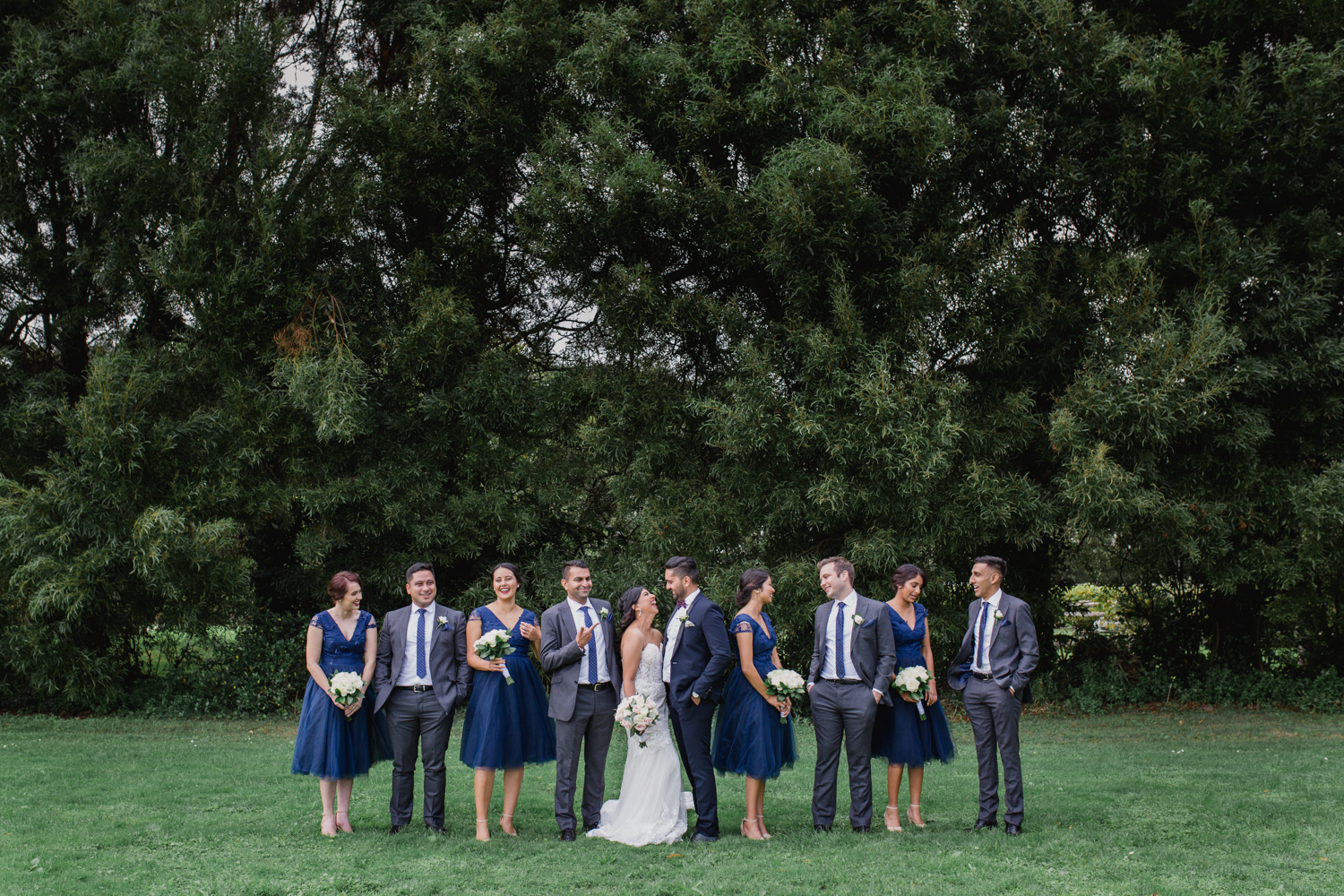 A Bride and Groom with their attendants taken by Mala Photography, an Auckland based wedding photographer. The wedding was at Markovina Vineyard Estate In Kumeu, Auckland.